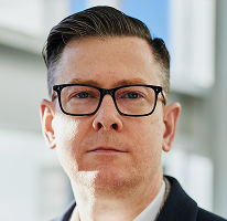 Portret al conducătorului executiv Alexander Hughes din compania de tranzacționare criptografică